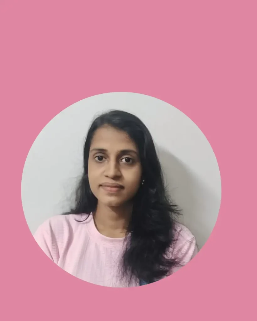 The best freelance digital marketer in Thrissur has long dark hair, wears a light pink top, smiles slightly, and is set against a plain background inside a circular pink frame.